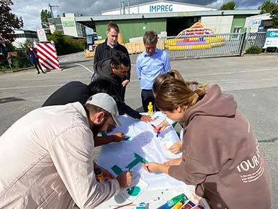 Teamwork task painting flags - IMPREG summer party 2022